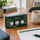 Personalised golf ball box on a desk as a Father's Day gift