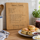Personalised bamboo chopping board displayed on a kitchen worktop