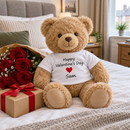 Personalised teddy bear with a Valentine's t-shirt beside red roses