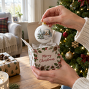 Bauble gift box opened by a Christmas tree