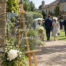 Personalised acrylic wedding welcome sign in a garden ceremony