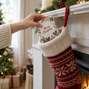 Bauble gift box being placed into a Christmas stocking