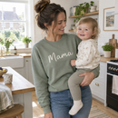 Mum holding her toddler while wearing a personalised sweatshirt