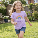 Girl playing in the garden in a personalised kids t-shirt with name and age