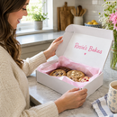 Customer unboxing a custom printed mailer box from a small business