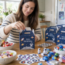 Parent filling personalised party favour boxes before a birthday party