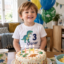 Toddler in a personalised birthday age t-shirt at his third birthday party