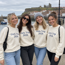 Friends on a seaside weekend in matching personalised sweatshirts