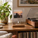 Personalised Our Song acrylic music plaque on a shelf beside a record player