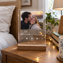 Personalised Our Song acrylic music plaque on a bedside table
