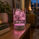 Personalised LED acrylic night light with colour-changing base on a shelf