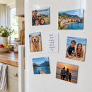 Personalised acrylic photo fridge magnets on a kitchen fridge