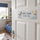 Personalised acrylic door plaque on a child's bedroom door