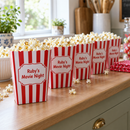 Personalised popcorn boxes lined up for a movie night party