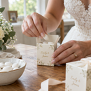 Bride filling personalised wedding favour boxes