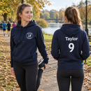 Runner warming up in a personalised club hoodie with name and number