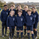 Junior football team in matching personalised club hoodies with logo
