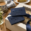 Spot gloss business cards tucked into a cake box