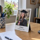 Personalised desk photo panel, on a home study desk in a UK house with a pen pot and notebook, daylight from a window
