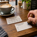 Loyalty cards being stamped on a café counter