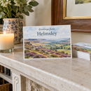 Custom printed postcards on a mantelpiece at home