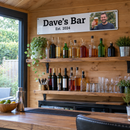 Personalised metal sign, mounted above a home bar in a garden room with bottles on shelves and no visible brand labels