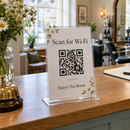 Acrylic QR code sign on a reception desk