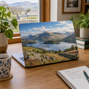 Custom laptop skin with a landscape photo on a home office desk