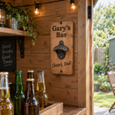 Personalised wooden bottle opener mounted in a garden bar