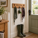 Personalised wooden dog lead hook in a hallway with leads