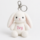 Personalised mini bunny keyring: a small soft white plush bunny rabbit keyring with a metal clip and ring, the bunny's tummy printed with the name 'Ivy' in pink letters