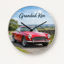 Personalised metal photo clock printed with a photo of a classic red sports car on a country road and the text Grandad Ken, on a plain background