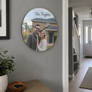 Personalised glass photo clock, hanging on a modern grey hallway wall in a new UK home