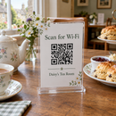 Acrylic QR code sign on a tea room table
