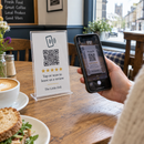 Tap and scan review stand being scanned in a café