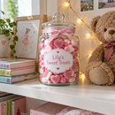 Personalised sweet jar with the name Lily on a child's bedroom shelf