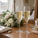 Personalised prosecco flute with the name Lucy on a bride's getting-ready table