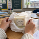 Personalised scented candle teacher gift being unwrapped