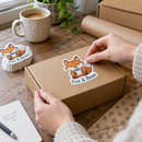 Custom die-cut stickers on a mailer box