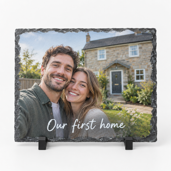 Personalised photo slate plaque with a photo and the message Our first home on a white background