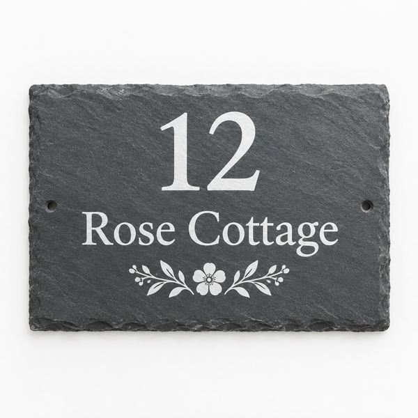 Personalised slate house sign with the name Rose Cottage on a white background