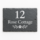 Personalised slate house sign with the name Rose Cottage on a white background