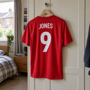 Football kit name and number printing hanging in a bedroom