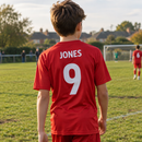 Football kit name and number printing worn on a grassroots pitch