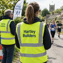 Hi-vis vest with logo worn by event marshals