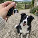 Personalised pet photo keyring: a woman's hand holding car keys on a personalised round metal pet photo keyring showing a black and white border collie and the name 'Fly'
