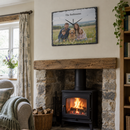 Personalised slate photo clock, hanging above a wood burner in a cosy cottage living room