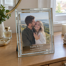 Personalised glass photo frame, a 23x18cm frame with a sparkling double mirror border and metal stand on a dressing table