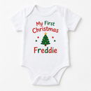 My first Christmas baby grow with the name Freddie on a white background