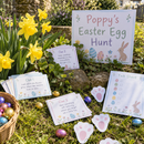 Personalised Easter egg hunt kit with the name Poppy clue cards in a spring garden